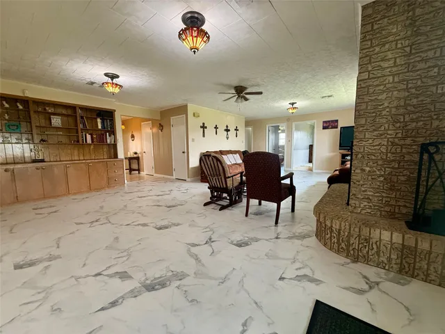 a view of a livingroom with furniture window and wooden floor