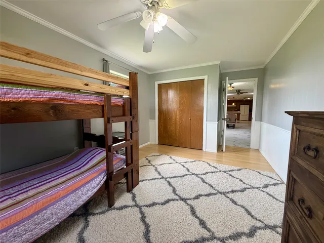 a bedroom with furniture and a chandelier
