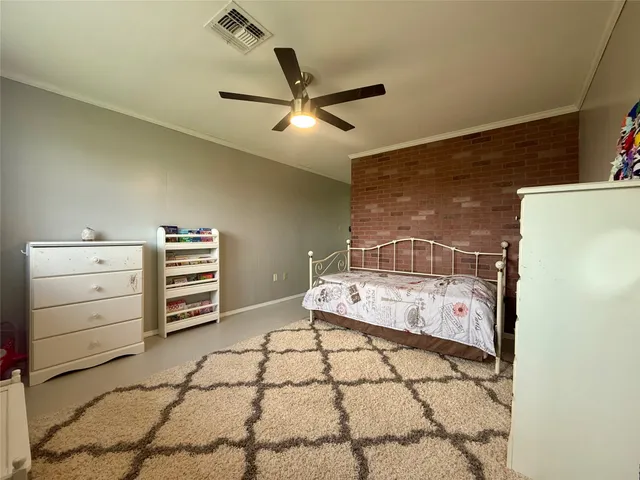 a bed room with a bed and a dresser