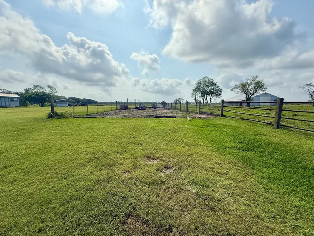 a view of a lake with a big yard