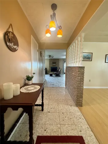 a view of a livingroom with furniture and a flat screen tv