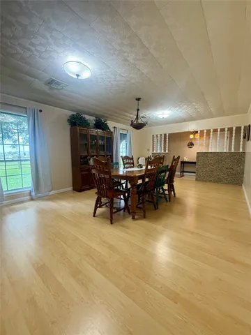 a livingroom with furniture and a large window