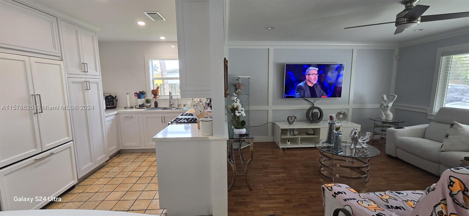 30018 Southwest 159th Drive Homestead, FL 33033 - Photo 12 of 27 a living room with furniture and a fireplace