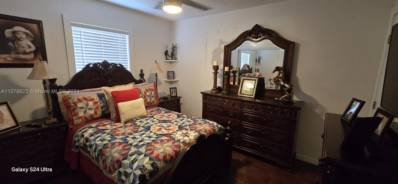 30018 Southwest 159th Drive Homestead, FL 33033 - Photo 17 of 27 a bedroom with a bed and a tv on dresser