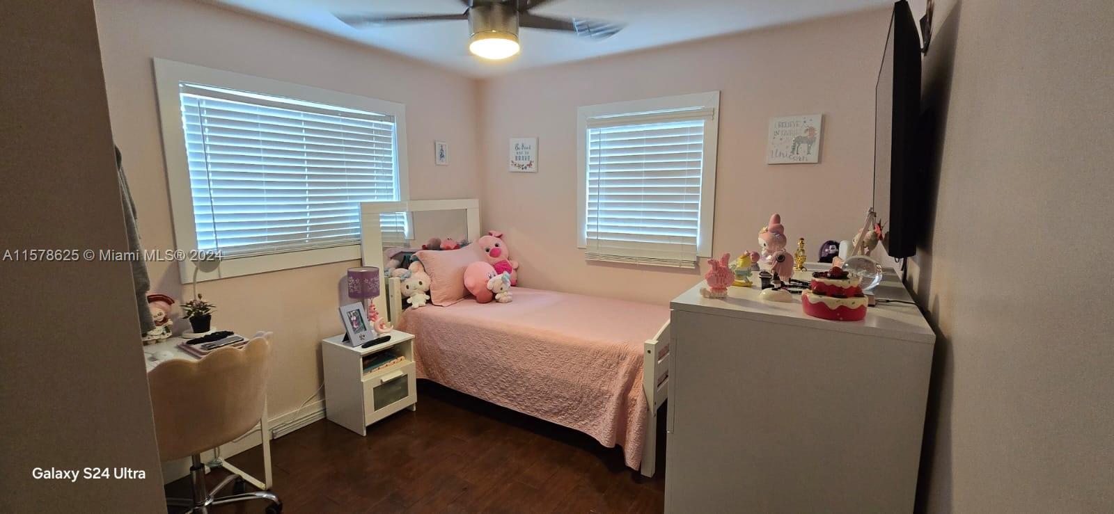 30018 Southwest 159th Drive Homestead, FL 33033 - Photo 19 of 27 a bedroom with a bed and a window