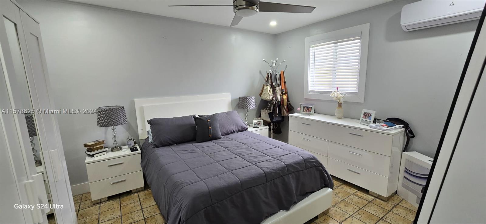 30018 Southwest 159th Drive Homestead, FL 33033 - Photo 23 of 27 a bedroom with a bed and a window