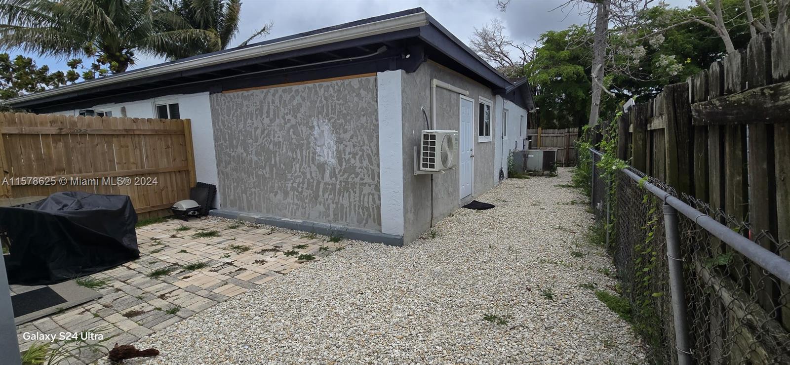 30018 Southwest 159th Drive Homestead, FL 33033 - Photo 26 of 27 a backyard of a house with lots of green space