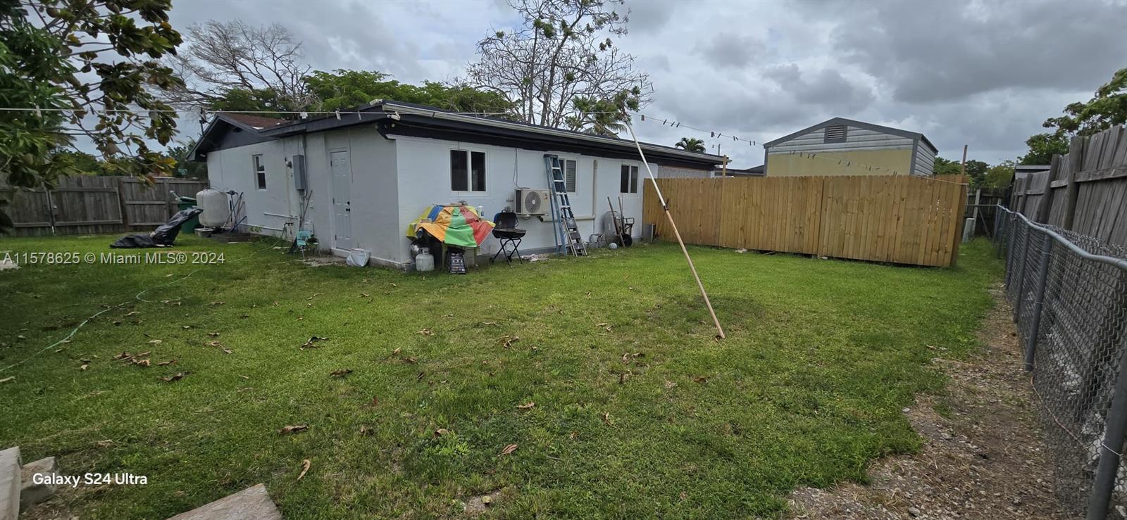 30018 Southwest 159th Drive Homestead, FL 33033 - Photo 5 of 27 a view of a house with backyard and garden