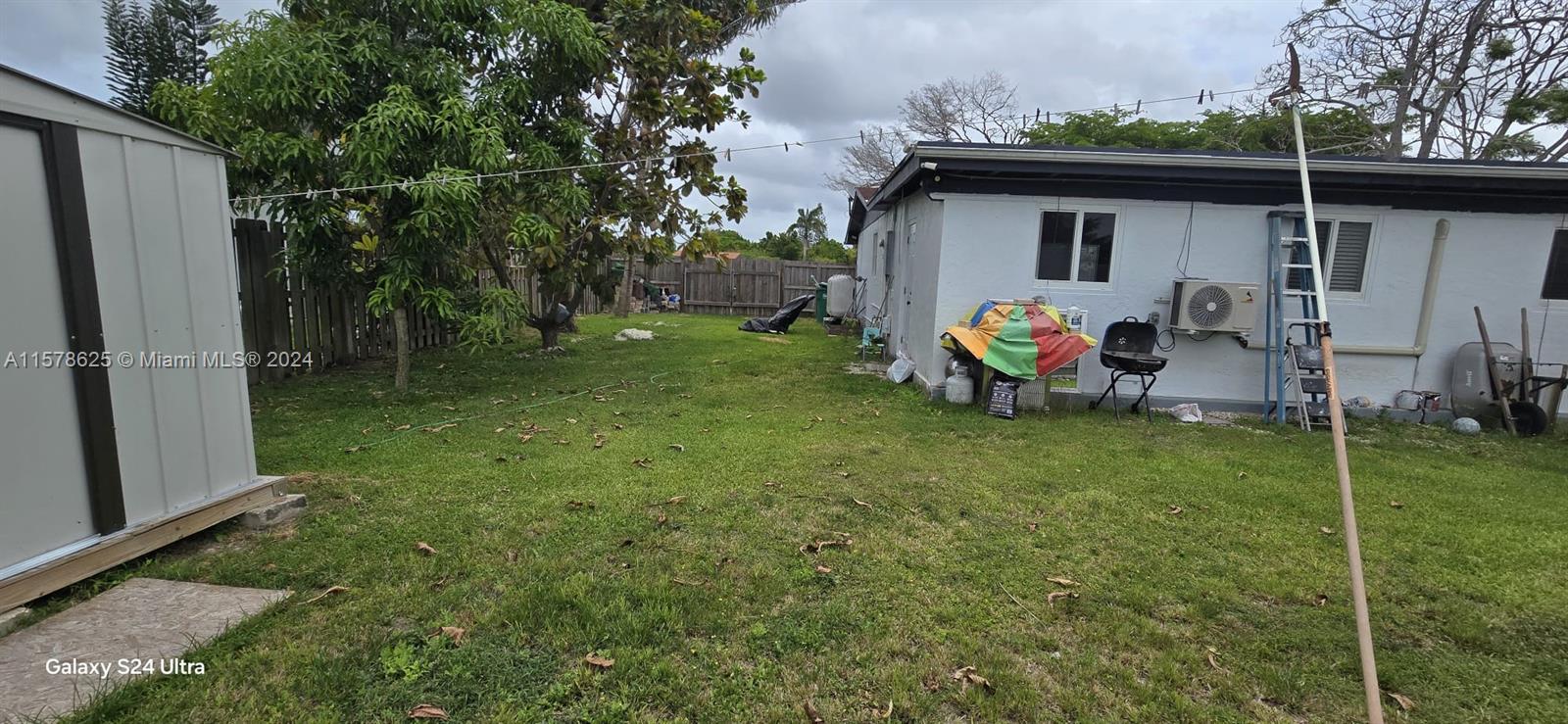 30018 Southwest 159th Drive Homestead, FL 33033 - Photo 6 of 27 a view of a backyard with small cabin