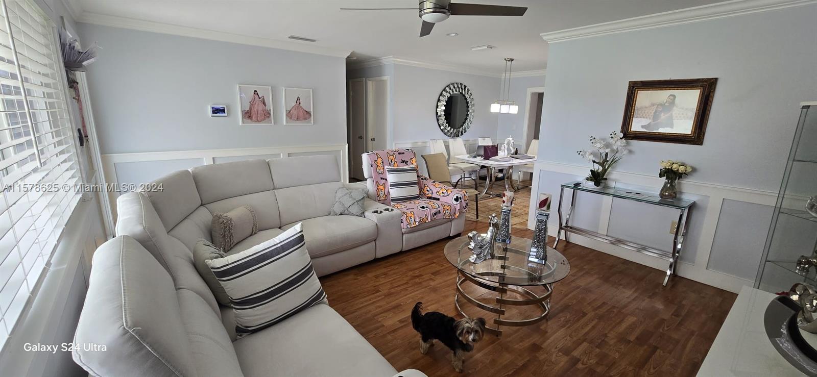30018 Southwest 159th Drive Homestead, FL 33033 - Photo 8 of 27 a living room with furniture or couch and a wooden floor