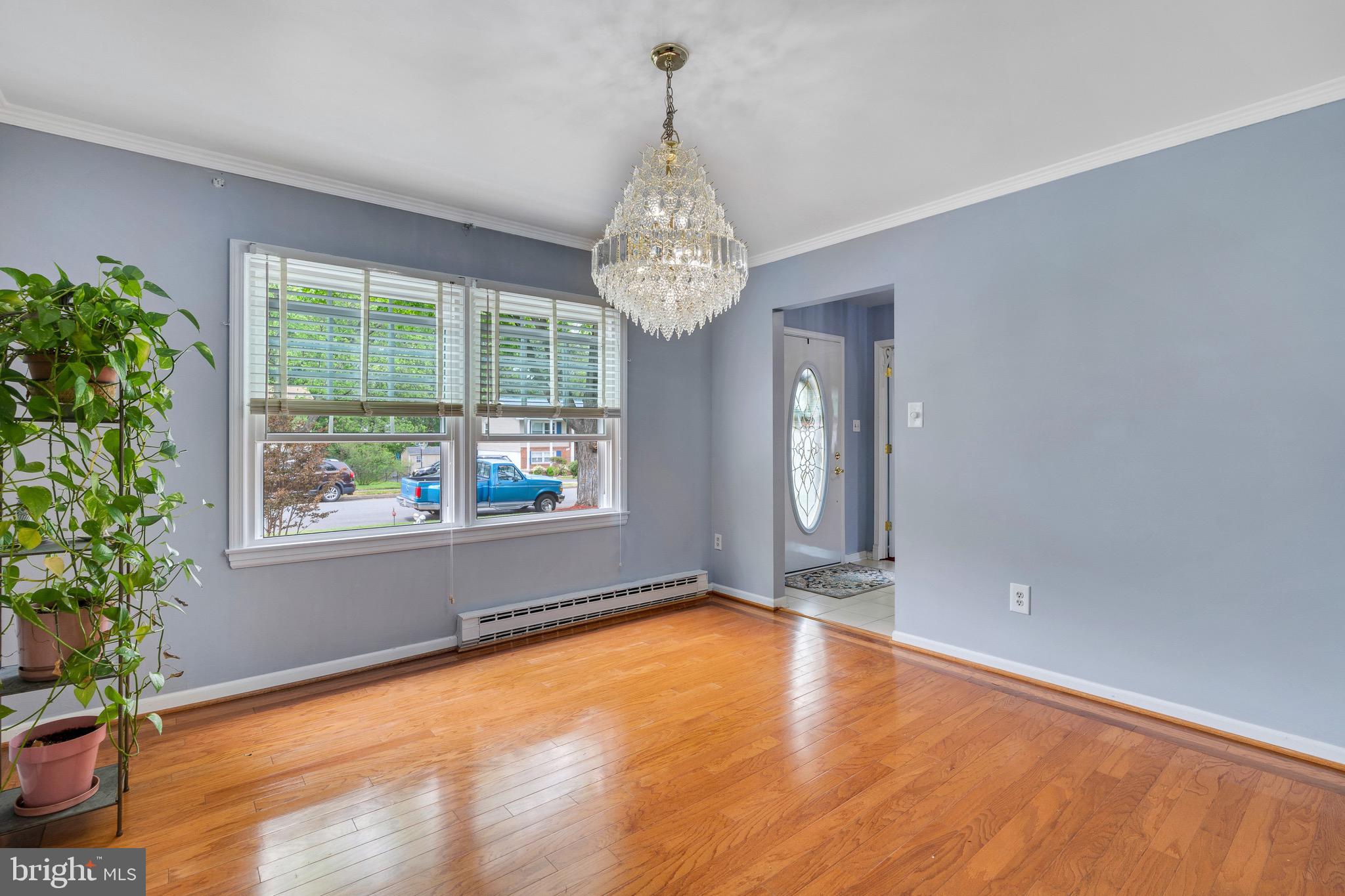 Formal Dining room with custom trim & chandelier