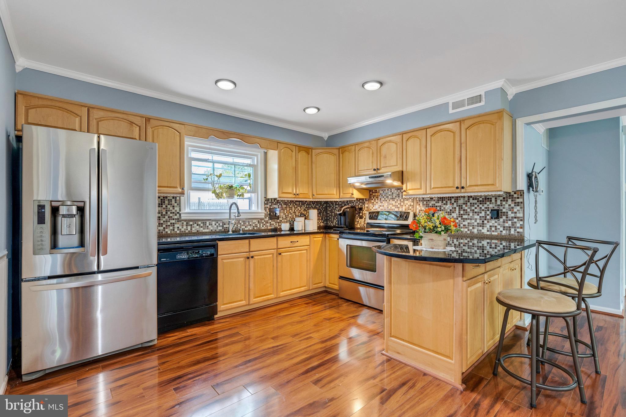 kitchen with breakfast bar and granite counters