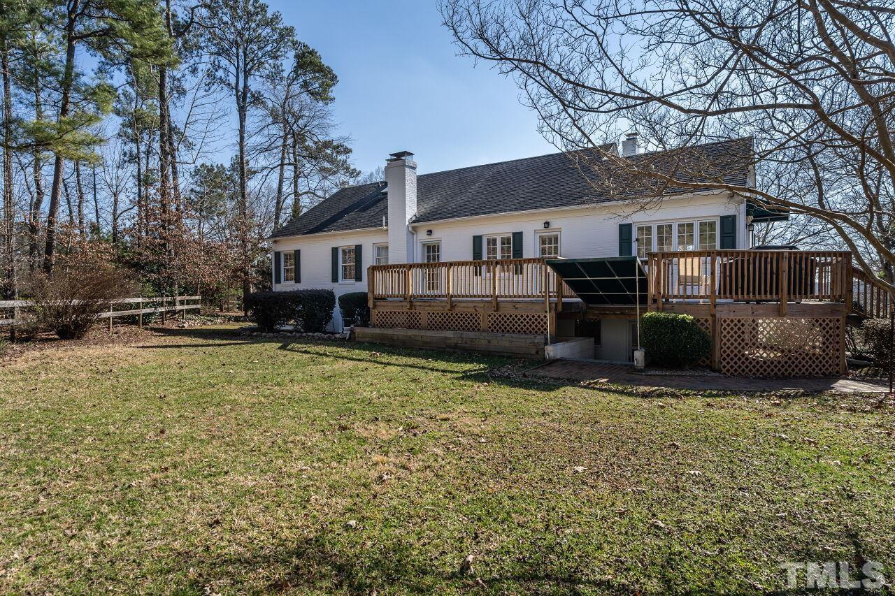 5212 Theys Road Raleigh, NC 27606 - Photo 45 of 55 a view of a house with a yard covered with snow in front of house