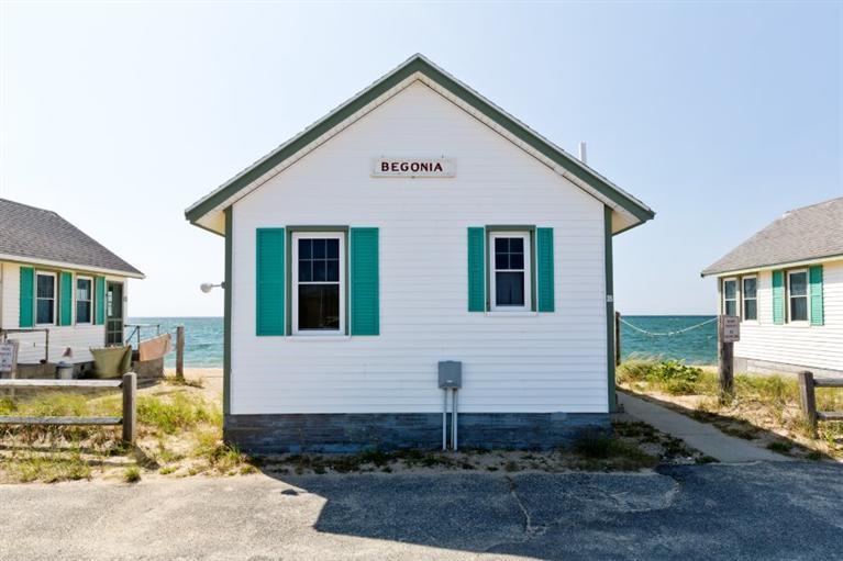 276 Shore Road, Unit 18 Truro, MA 02666 - Photo 1 of 12 a view of a house with a yard