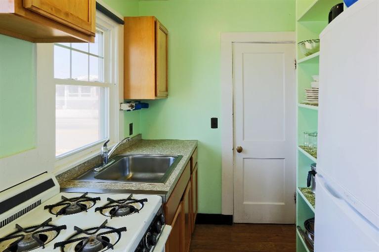 276 Shore Road, Unit 18 Truro, MA 02666 - Photo 8 of 12 a bathroom with a sink and a stove
