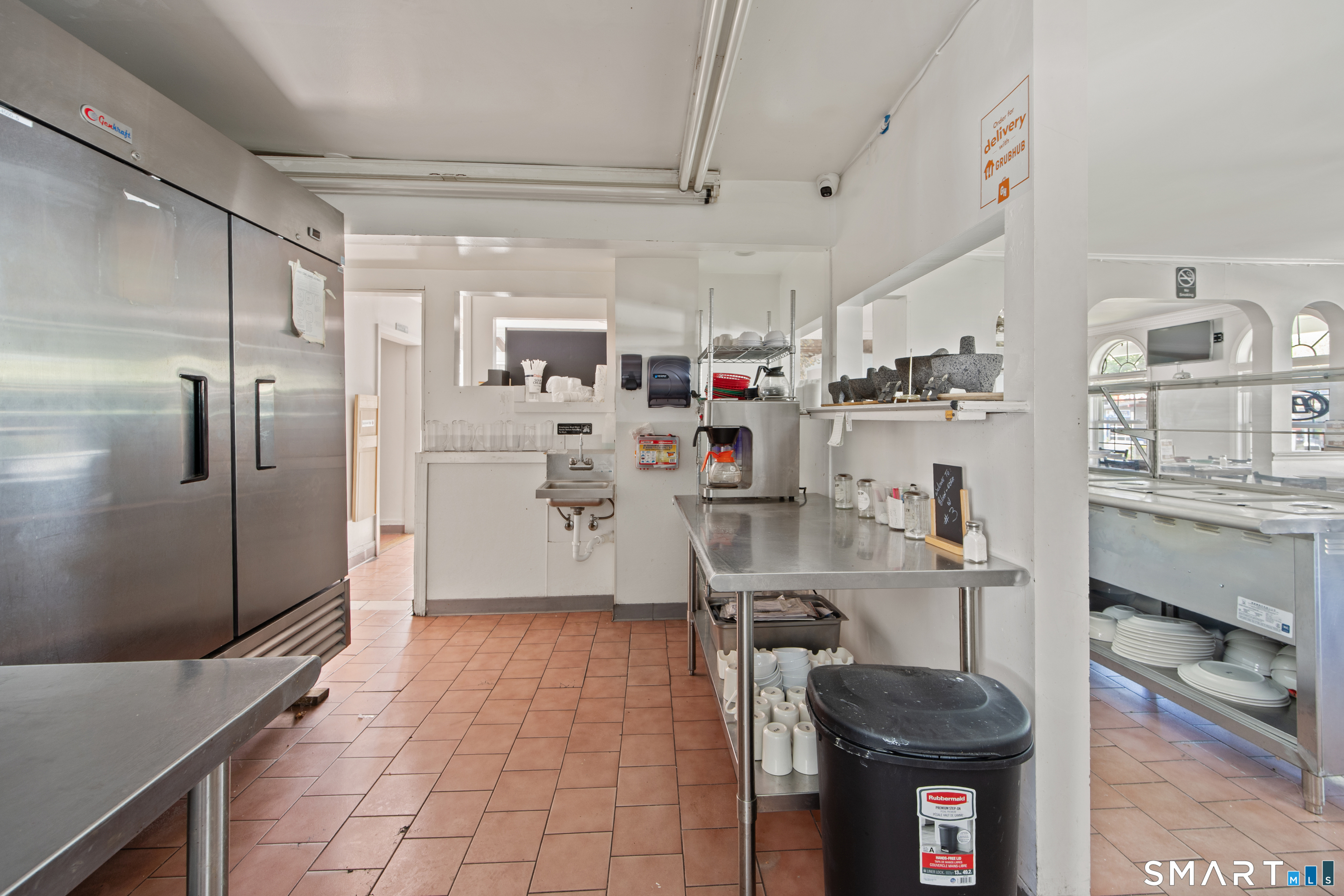 277 South Main Street Torrington, CT 06790 - Photo 9 of 26 a kitchen with stainless steel appliances a refrigerator and a stove