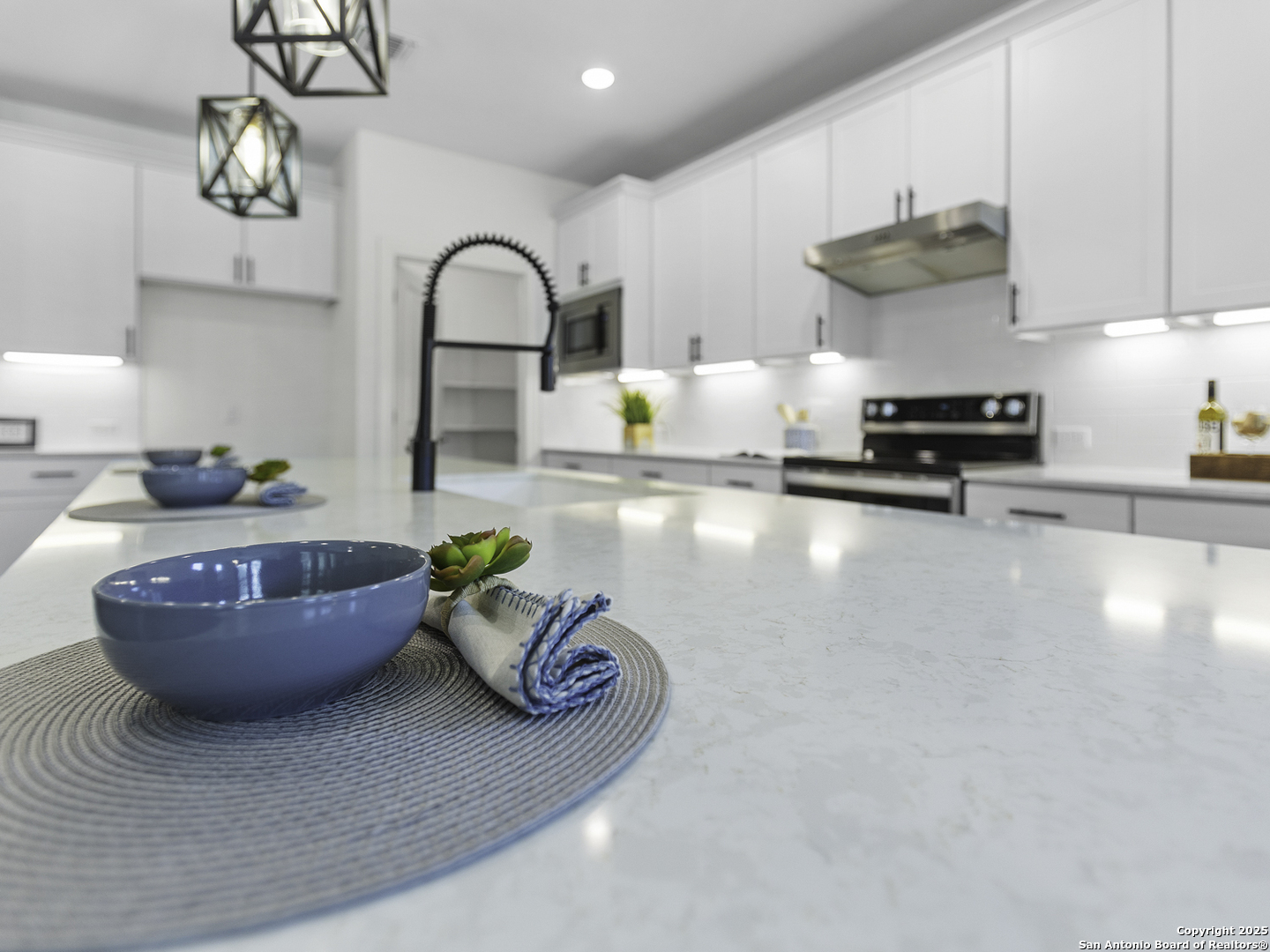 125 Slenderleaf Marble Falls, TX 78654 - Photo 12 of 49 a kitchen with a sink a stove and chandelier