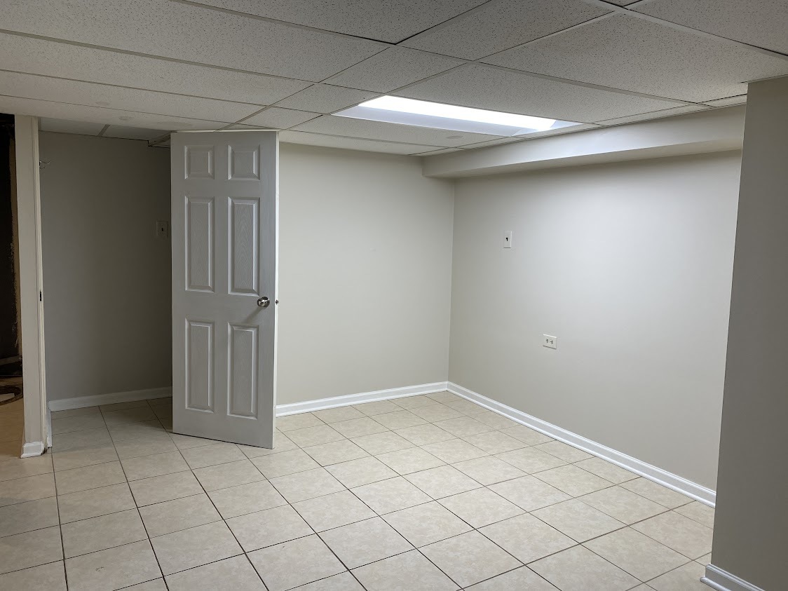 459 West Butterfield Road Elmhurst, IL 60126 - Photo 12 of 17 an empty room with white door