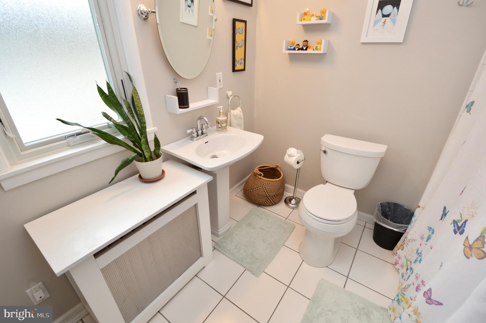 18 10th Avenue Haddon Heights, NJ 08035 - Photo 12 of 22 a bathroom with a toilet sink and mirror