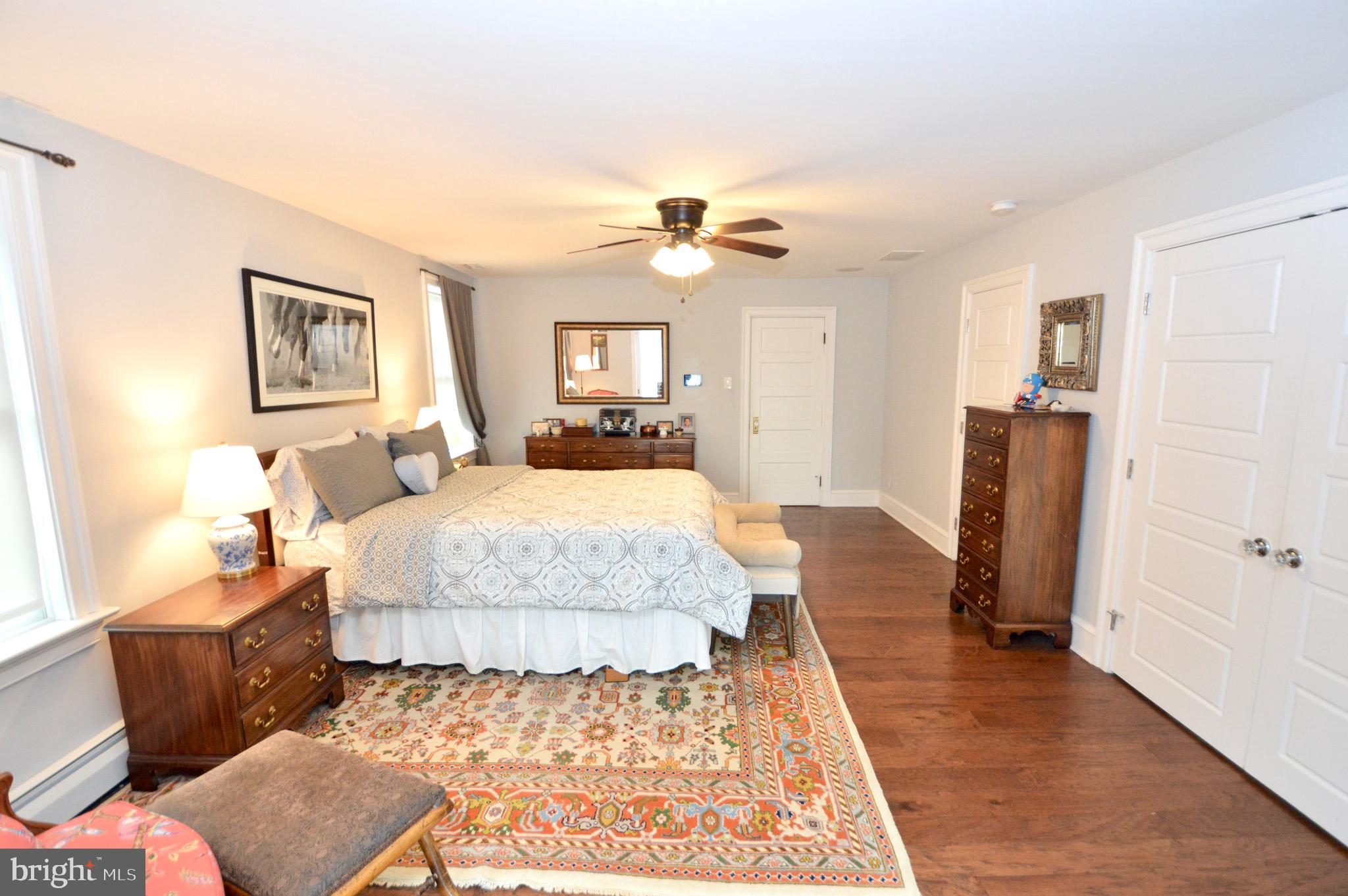 18 10th Avenue Haddon Heights, NJ 08035 - Photo 15 of 22 a spacious bedroom with a bed and a walk in closet