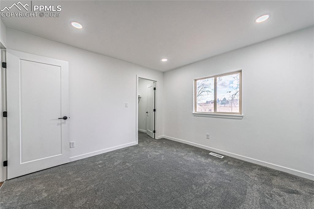 12480 Partridge Lane Peyton, CO 80831 - Photo 14 of 38 an empty room with windows