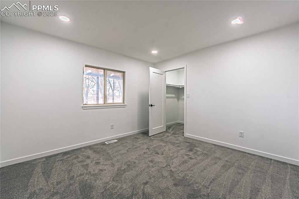 12480 Partridge Lane Peyton, CO 80831 - Photo 18 of 38 an empty room with windows