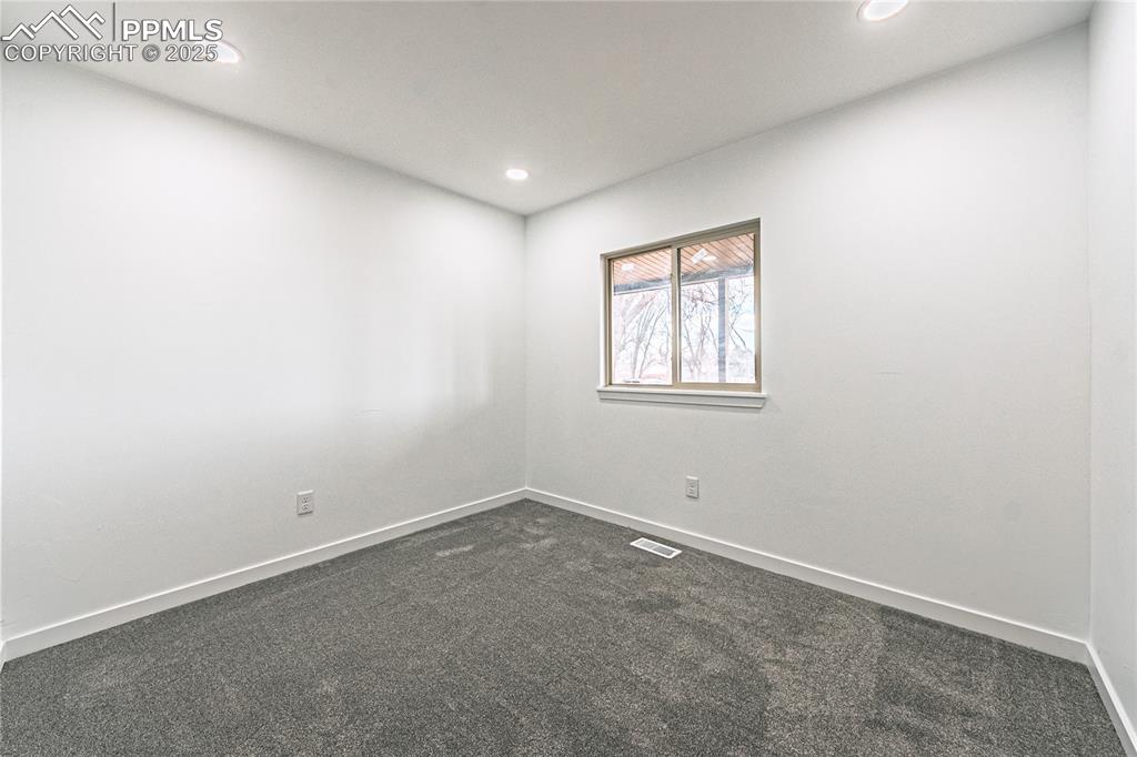 12480 Partridge Lane Peyton, CO 80831 - Photo 22 of 38 an empty room with windows