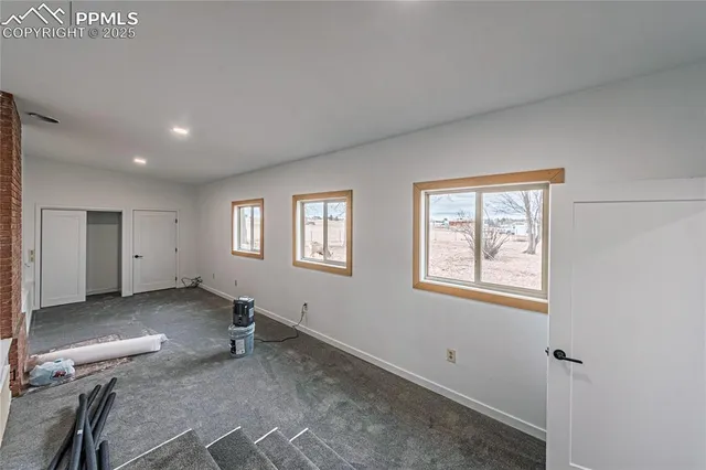 an empty room with windows