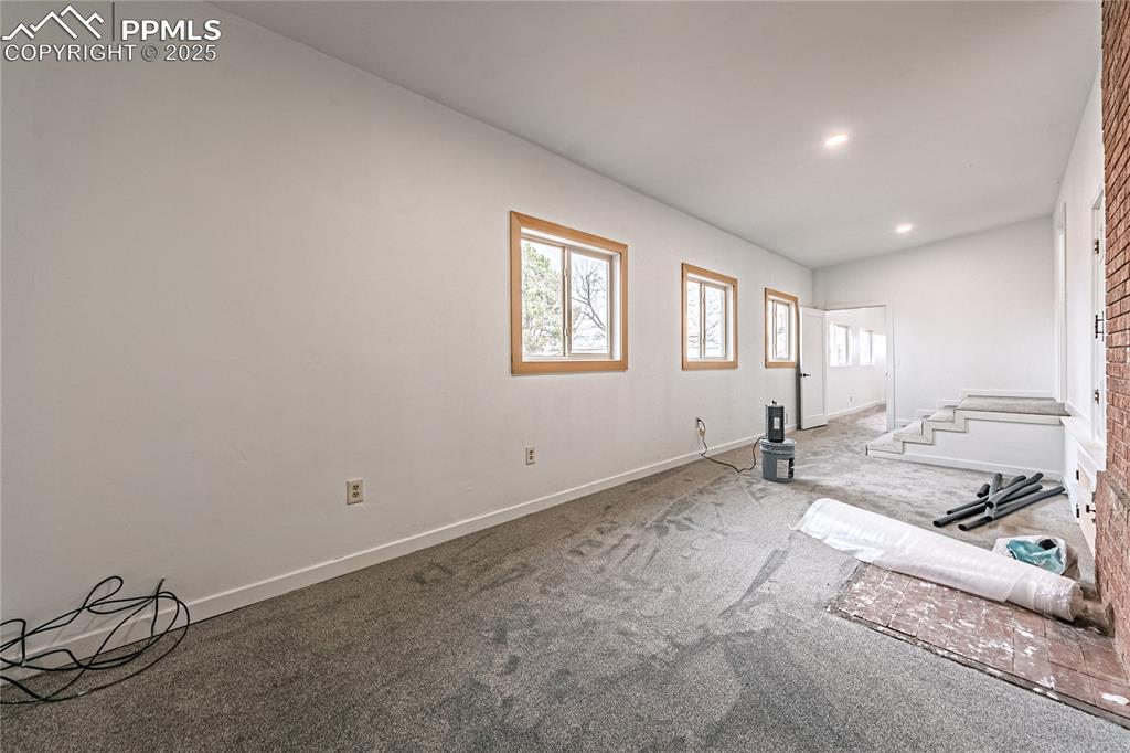 12480 Partridge Lane Peyton, CO 80831 - Photo 29 of 38 a view of a livingroom with wooden floor and a window