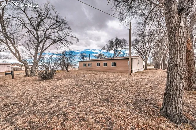 a view of a house with a snow in the yard
