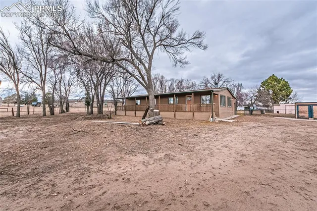 a view of outdoor space with deck and tree