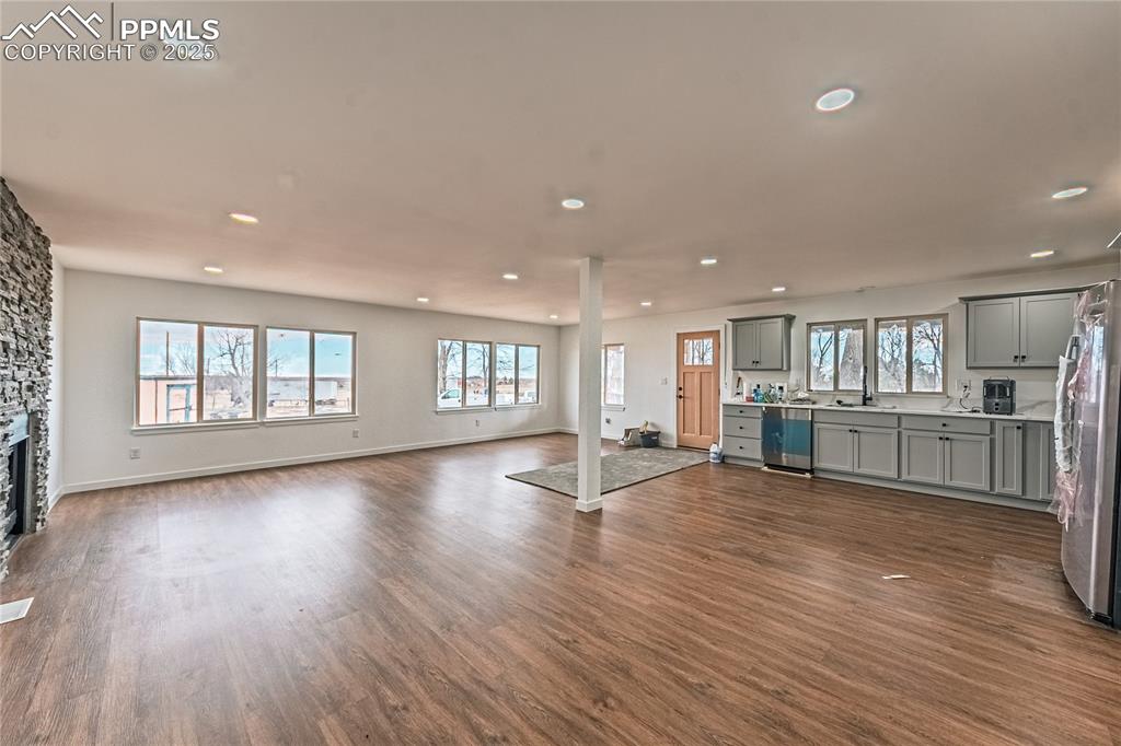 12480 Partridge Lane Peyton, CO 80831 - Photo 7 of 38 a view of a kitchen with furniture and wooden floor