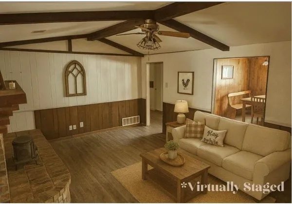 a living room with furniture and a rug