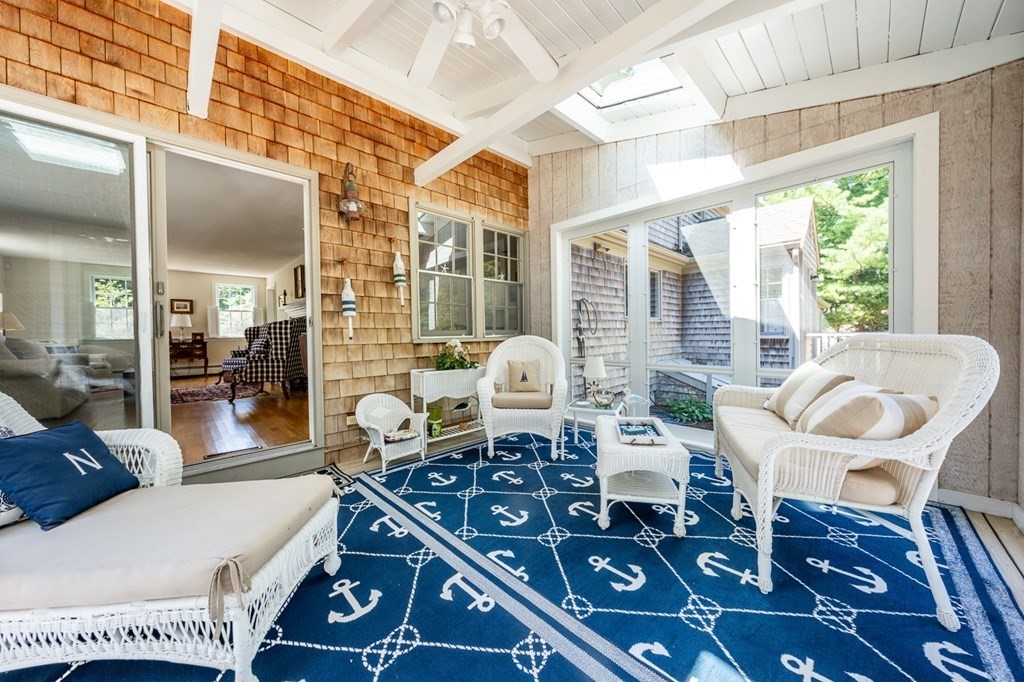 104 Cherry Tree Road Barnstable, MA 02635 - Photo 12 of 22 a living room with furniture and a floor to ceiling window