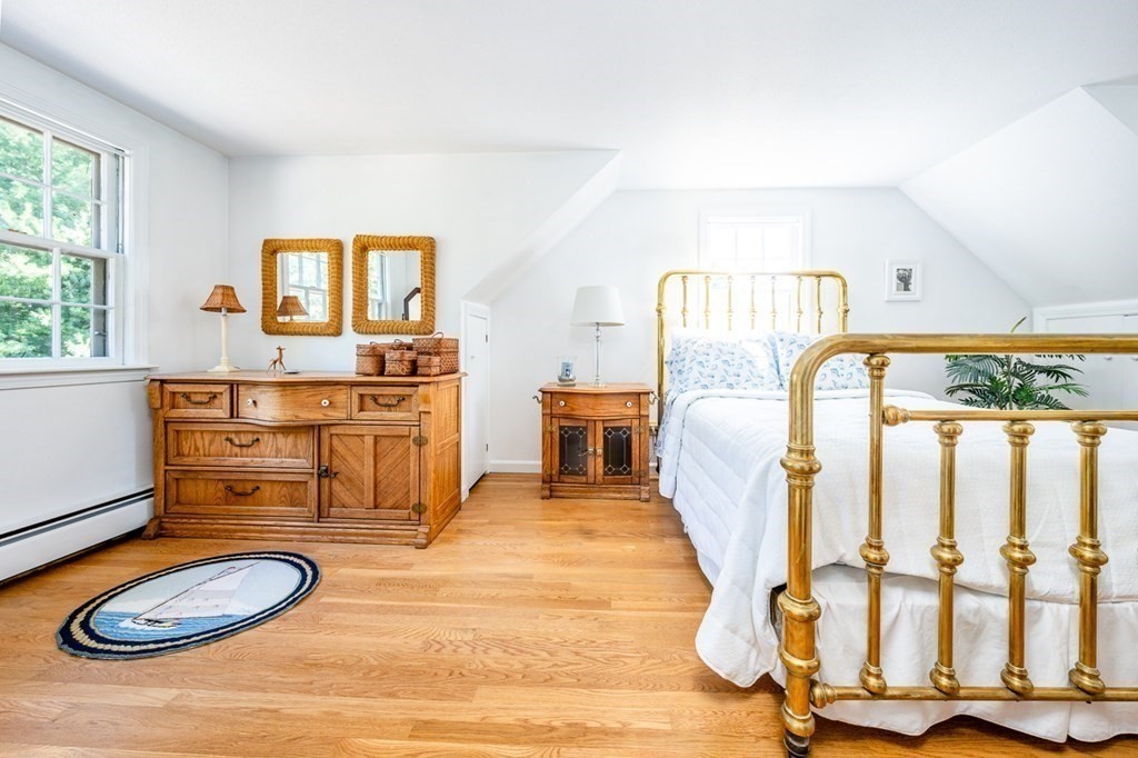 104 Cherry Tree Road Barnstable, MA 02635 - Photo 13 of 22 a dining room with wooden floor and furniture