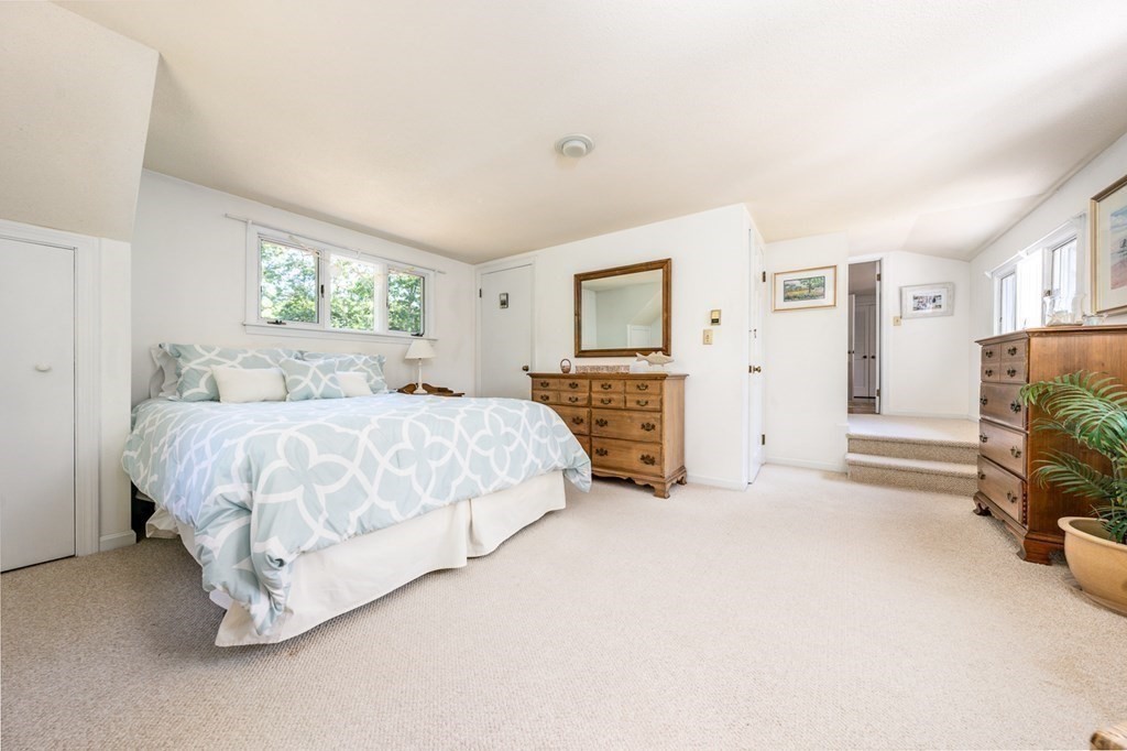 104 Cherry Tree Road Barnstable, MA 02635 - Photo 17 of 22 a spacious bedroom with a bed and a couch