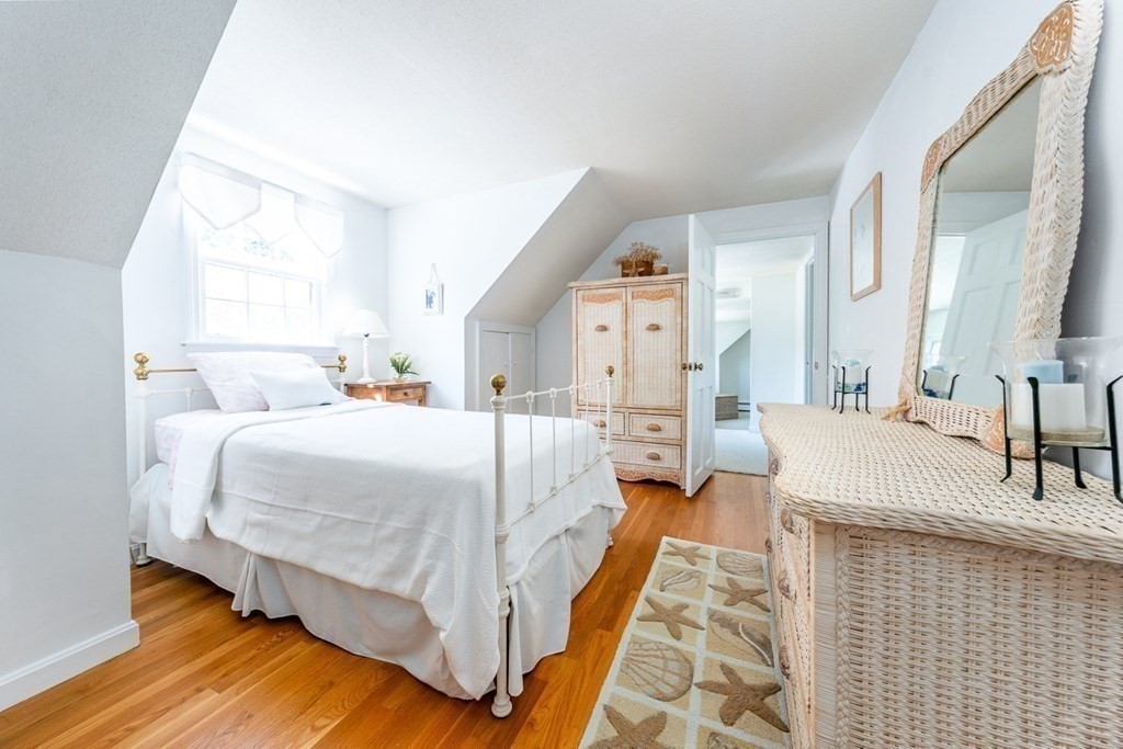 104 Cherry Tree Road Barnstable, MA 02635 - Photo 20 of 22 a spacious bedroom with a bed and a mirror