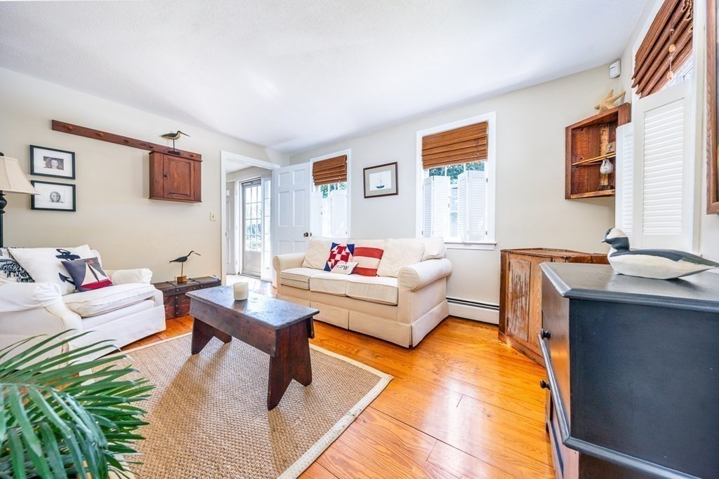 104 Cherry Tree Road Barnstable, MA 02635 - Photo 6 of 22 a living room with furniture and a table