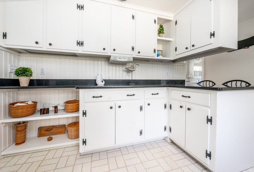 104 Cherry Tree Road Barnstable, MA 02635 - Photo 8 of 22 a view of white cabinets and a counter space