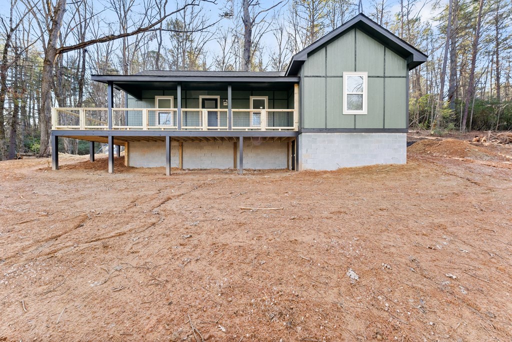 1410 Sky Lake Road Sautee Nacoochee, GA 30571 - Photo 11 of 37 a view of house with a yard and large windows