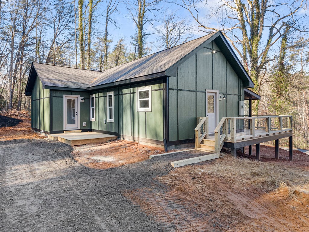 1410 Sky Lake Road Sautee Nacoochee, GA 30571 - Photo 12 of 37 a view of a house with backyard porch and sitting area