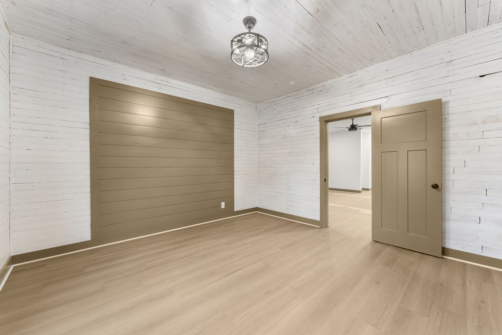 1410 Sky Lake Road Sautee Nacoochee, GA 30571 - Photo 16 of 37 an empty room with wooden floor and windows