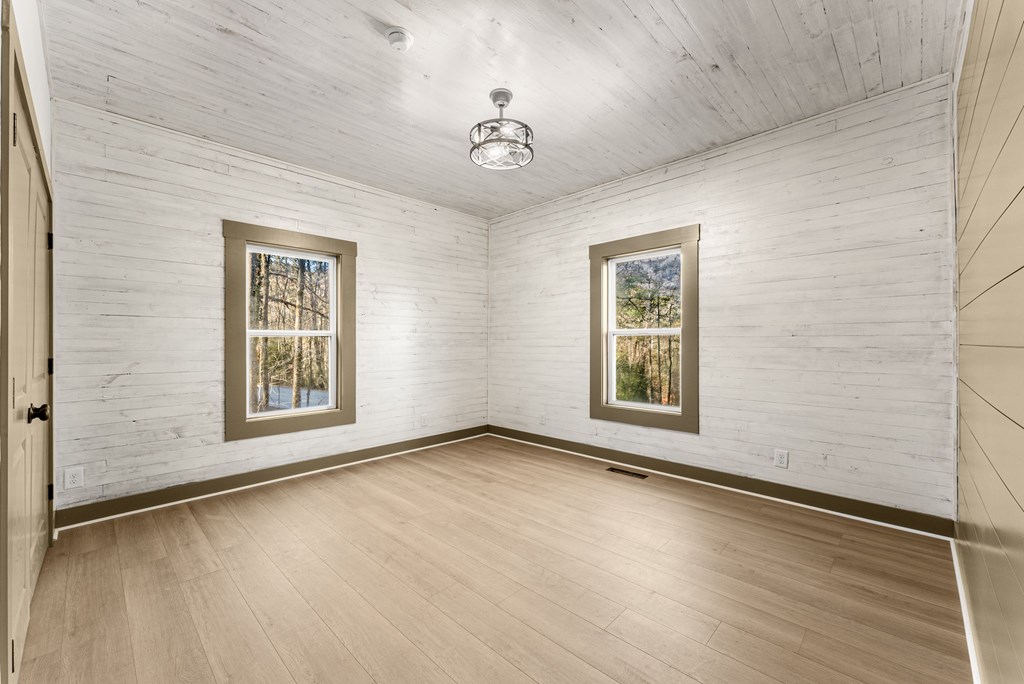 1410 Sky Lake Road Sautee Nacoochee, GA 30571 - Photo 27 of 37 a view of an empty room with a window and wooden floor