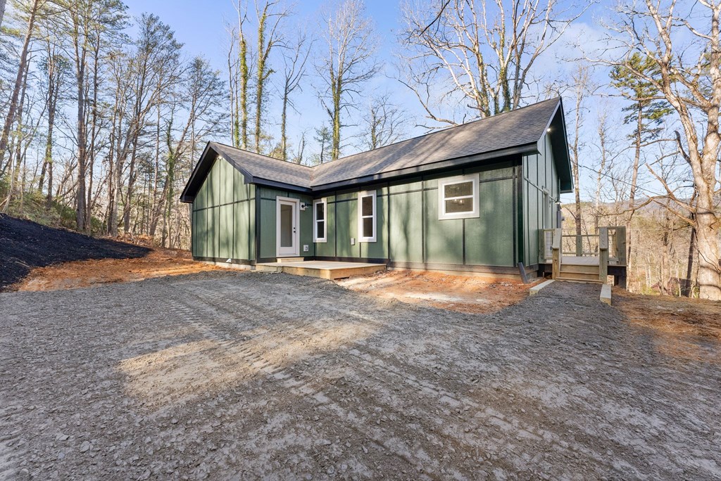 1410 Sky Lake Road Sautee Nacoochee, GA 30571 - Photo 30 of 37 a view of large house with a yard and large tree