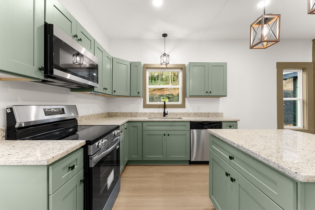 1410 Sky Lake Road Sautee Nacoochee, GA 30571 - Photo 8 of 37 a kitchen with stainless steel appliances granite countertop a sink stove and microwave