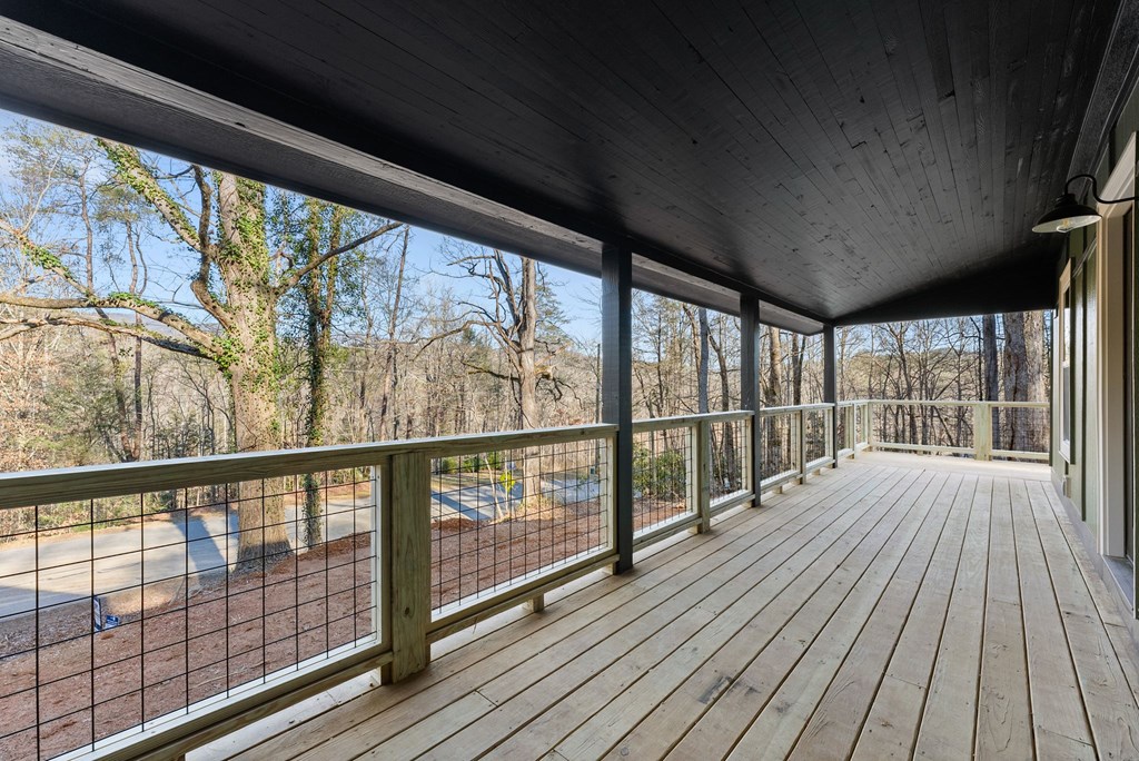 1410 Sky Lake Road Sautee Nacoochee, GA 30571 - Photo 9 of 37 a view of a balcony with wooden floor