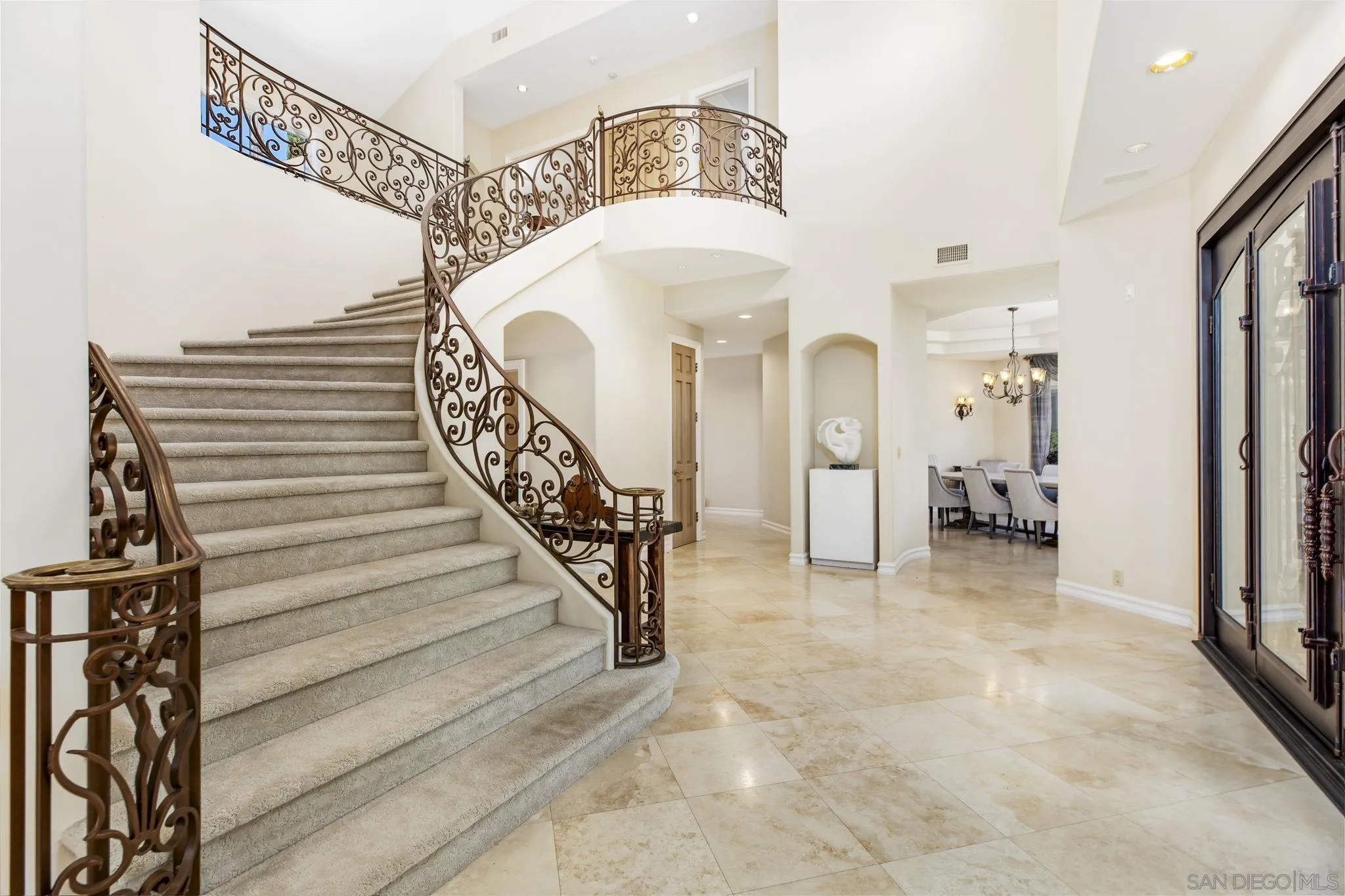 14440 Ridge Ranch Road Valley Center, CA 92082 - Photo 27 of 73 a view of a hallway with entryway wooden floor and a chandelier