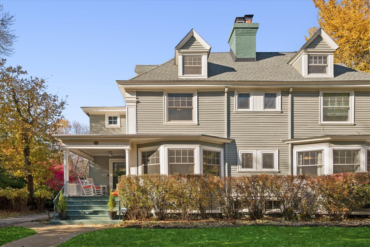 1570 Ashland Avenue Evanston, IL 60201 - Photo 1 of 40 a front view of a house with a yard and trees