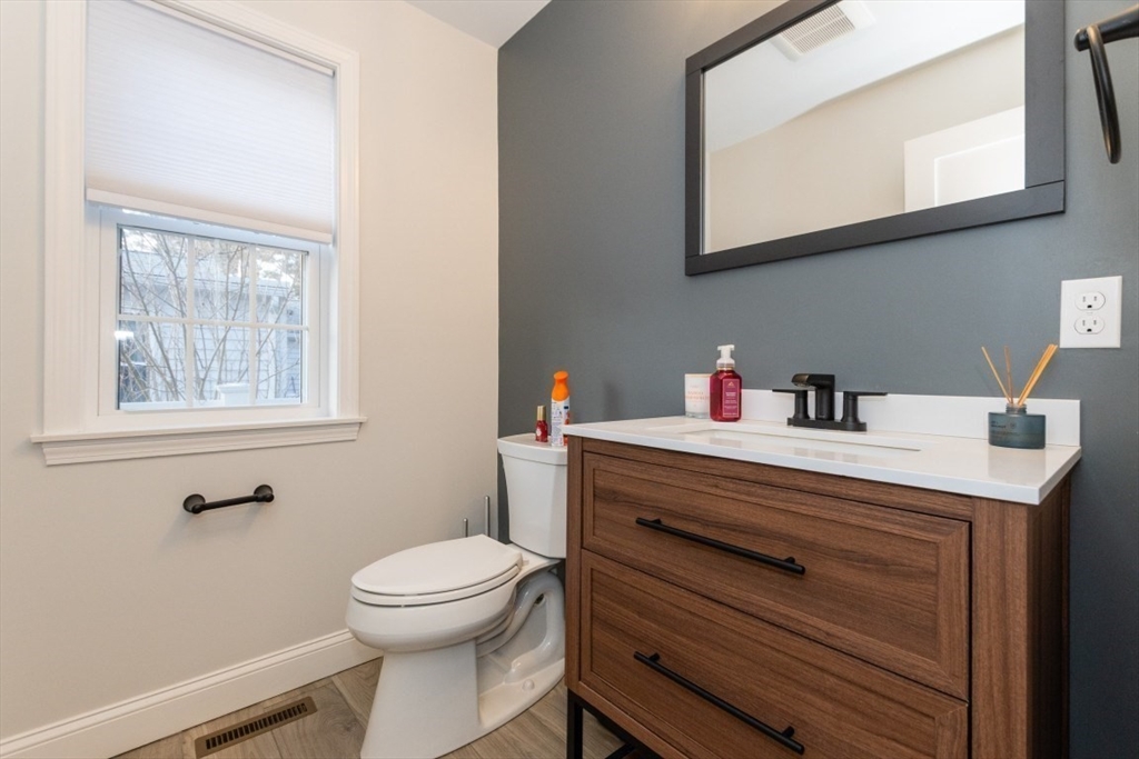 21 Juniper Road Norton, MA 02766 - Photo 15 of 33 a bathroom with a sink a mirror and a toilet