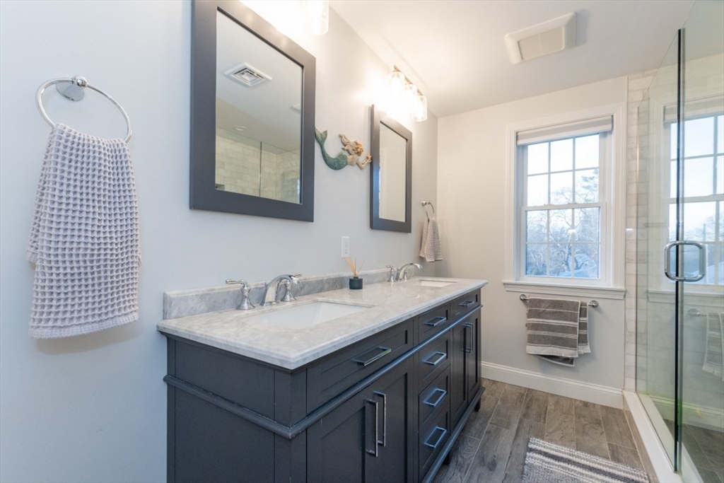 21 Juniper Road Norton, MA 02766 - Photo 20 of 33 a bathroom with a sink double vanity and a mirror